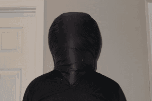 A back profile of a man wearing a down balaclava in black color.