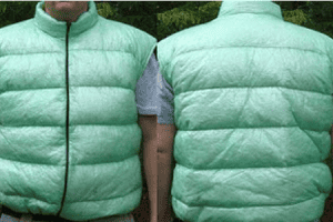 A front and back view, side by side, of a man wearing a zip-front custom cuben fiber down vest.