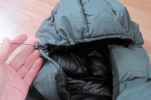 A detail image of the hood and cinch cord on a custom Goosefeet Gear down jacket.