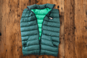 A full zippered-front custom forest green ultralight Goosefeet Gear down vest.