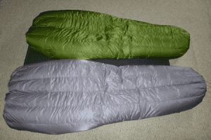 Top (front) view of two Goosefeet Gear custom down quilts. The top quilt is green and the bottom quilt is grey.